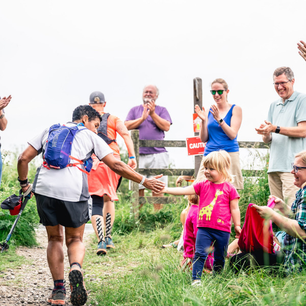 Ultramarathon participant receives a high 5