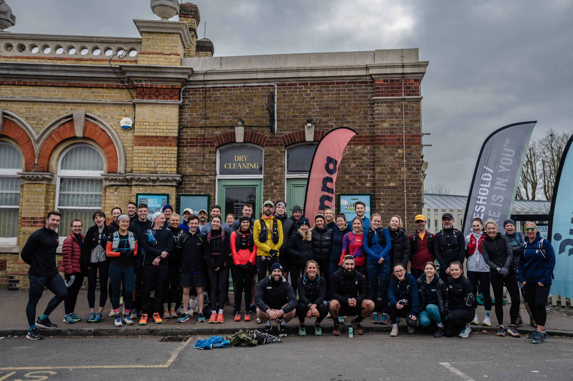 Runners smiling for picture before heading to trails