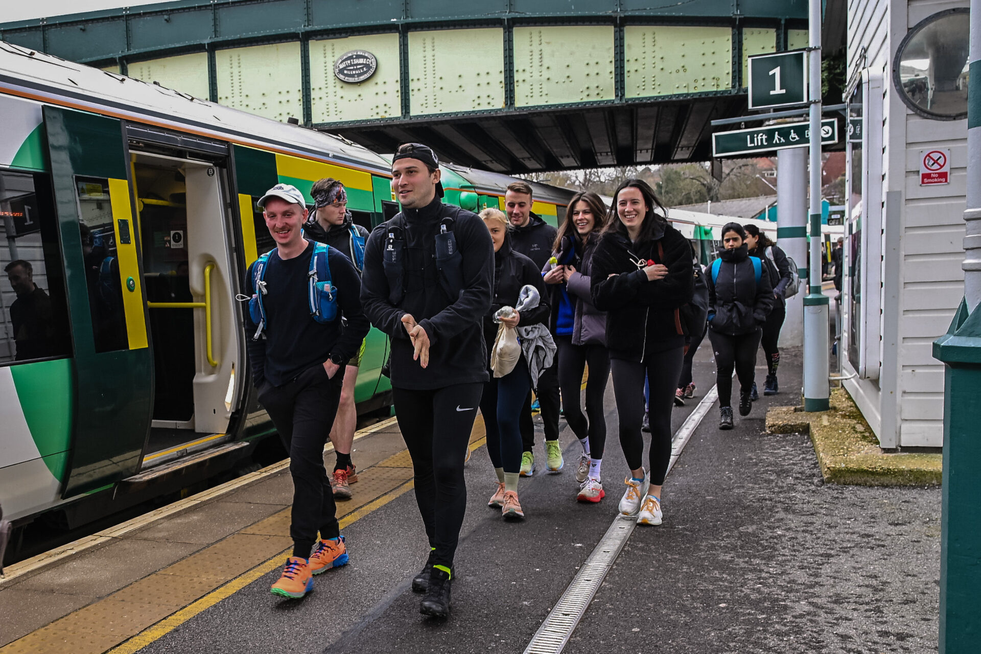 Runners walking off the train to the trails 