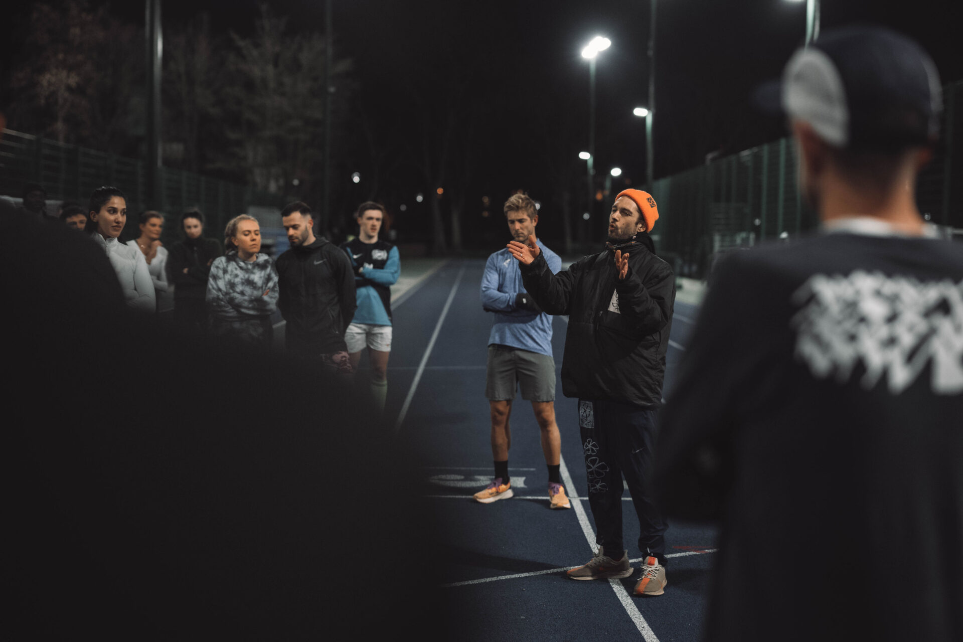 Track Mafia coach teaching runners 